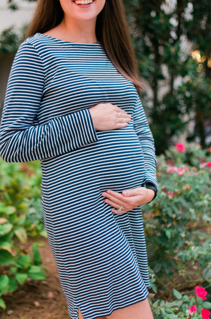 Maternity Style Tip -Don't rush to buy maternity clothes! Check your closet for loose fitted dresses that will still fit over the early bump!