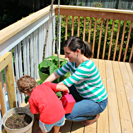 Mother and son working in the garden.
