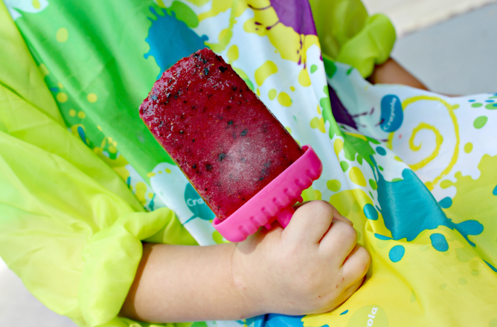 Homemade Strawberry-Blueberry Popsicles from Live Well Play Together. These homemade mixed berry pops are the perfect treat to cool off during the summer. Quick, healthy, and kid-friendly! #popsicles #frozenpops #icepops #healthysnacks #summersnacks #summerfood #strawberries #blueberries #kidfriendlyrecipes