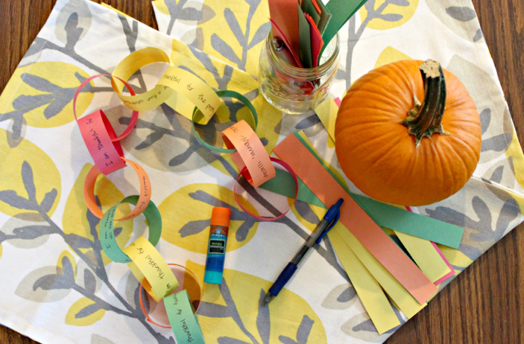 This Thanksgiving Paper Chain is a great way to teach kids about gratitude and giving thanks. Rather than a countdown, it's a count up to Thanksgiving where each family member lists one thing they are thankful for each day to add a link to the chain! From livewellplaytogether.com #thanksgivingcrafts #thanksgivingtraditions #teachingkidsaboutthanksgiving #thanksgivingpapercrafts