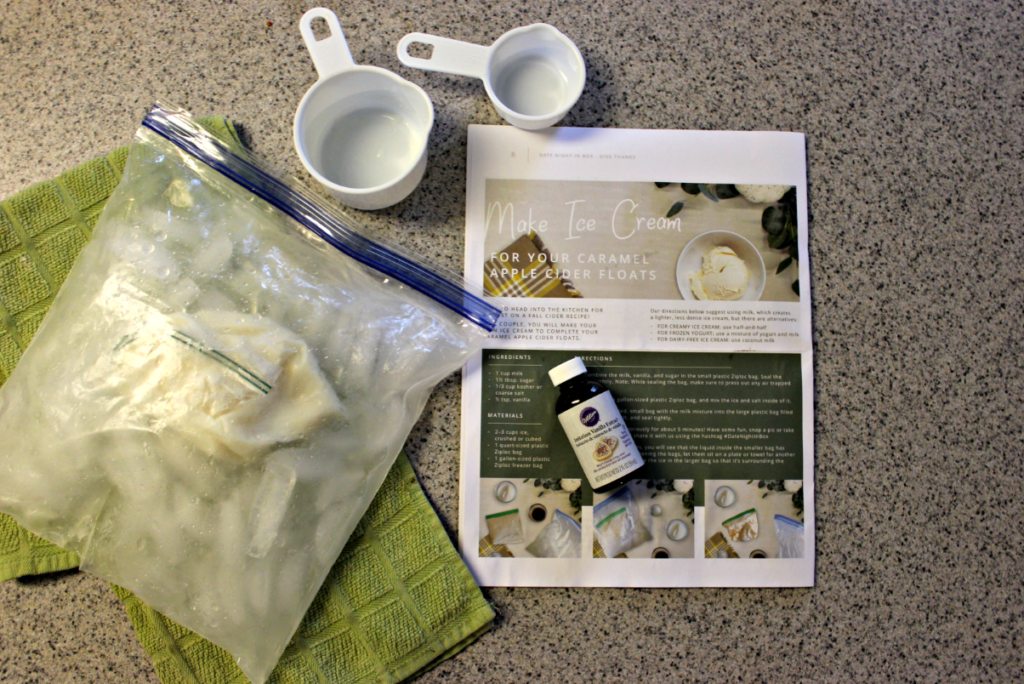 Homemade ice cream in a plastic bag on a green towel on the kitchen counter