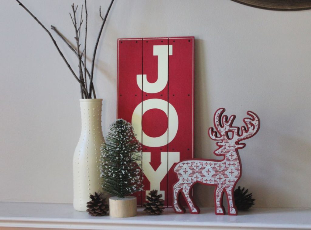 Christmas Mantel Ideas - Wooden signs and small Christmas Trees to decorate mantel for Christmas