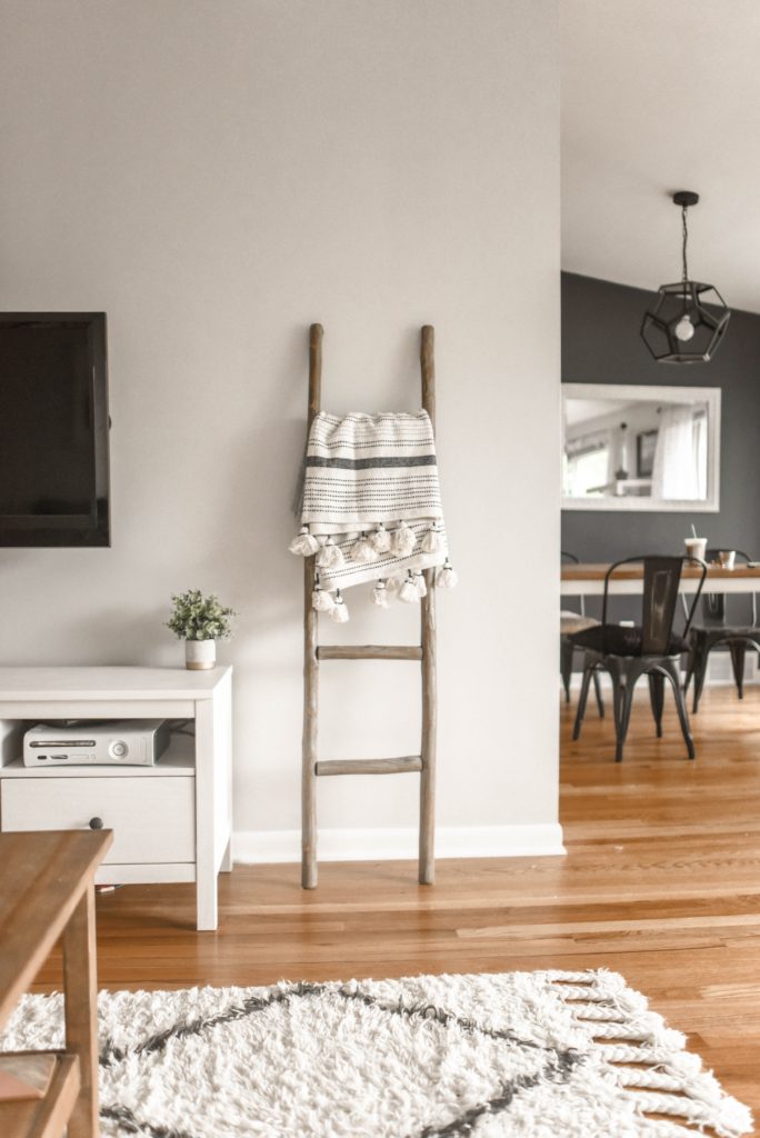 Wooden Blanket ladder in living room. Top Reasons Why You Should Declutter Your Home. Benefits of decluttering your home