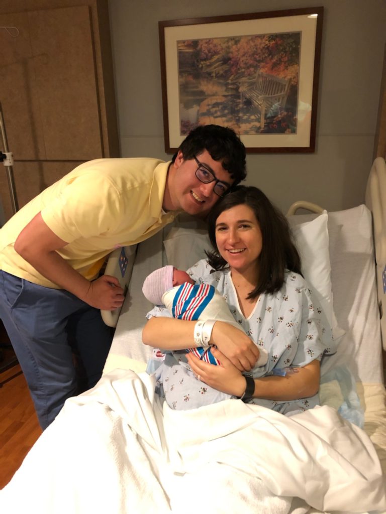 Proud parents holding newborn baby in the hospital. Welcoming our third baby - a hospital birth story