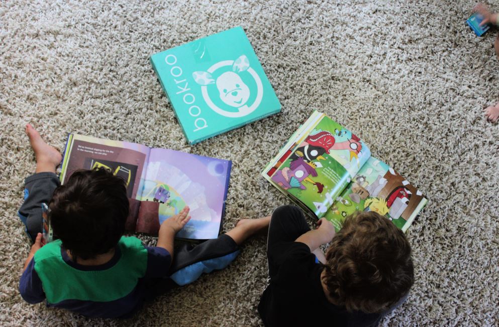 Kids reading picture books from Bookroo box. Our full Bookroo box review
