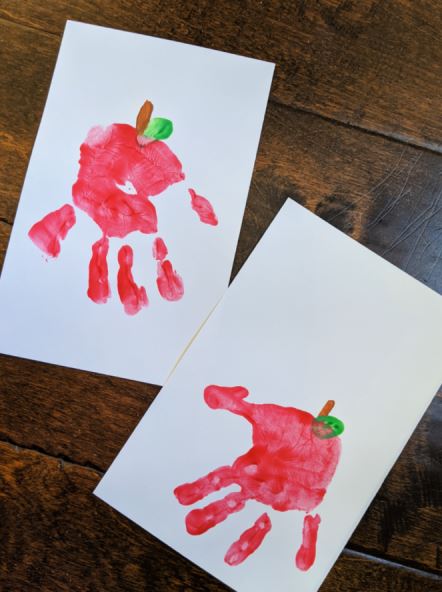 Handprint apples are the perfect fall or back to school craft for your kids this year!